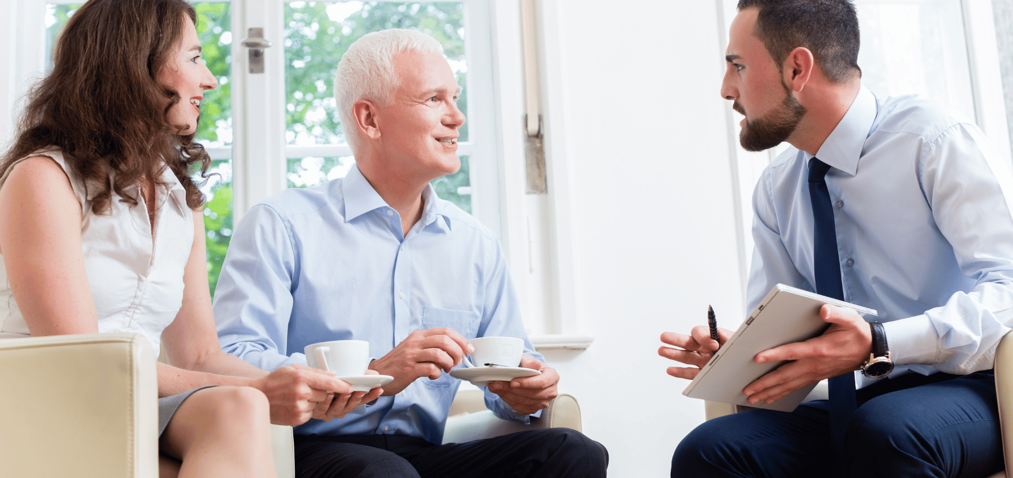 A financial advisor discussed with an older gentleman and a middle age lady.